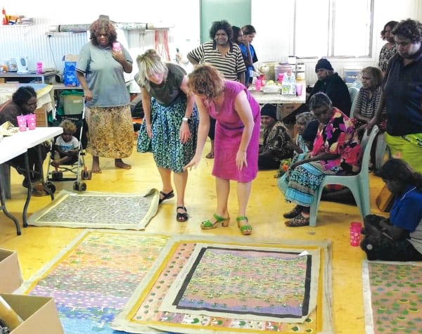 Rebecca Hossack with Aboriginal Ampilatwatja artists in Ampilatwatja, Australia