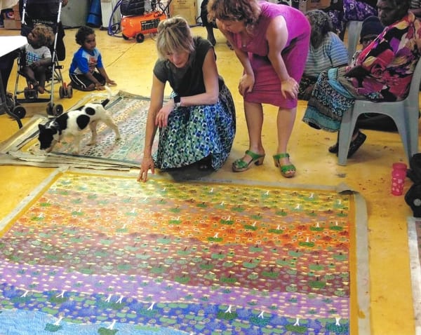 Rebecca Hossack with Ampilatwatja Aboriginal artists in Ampilatwatja