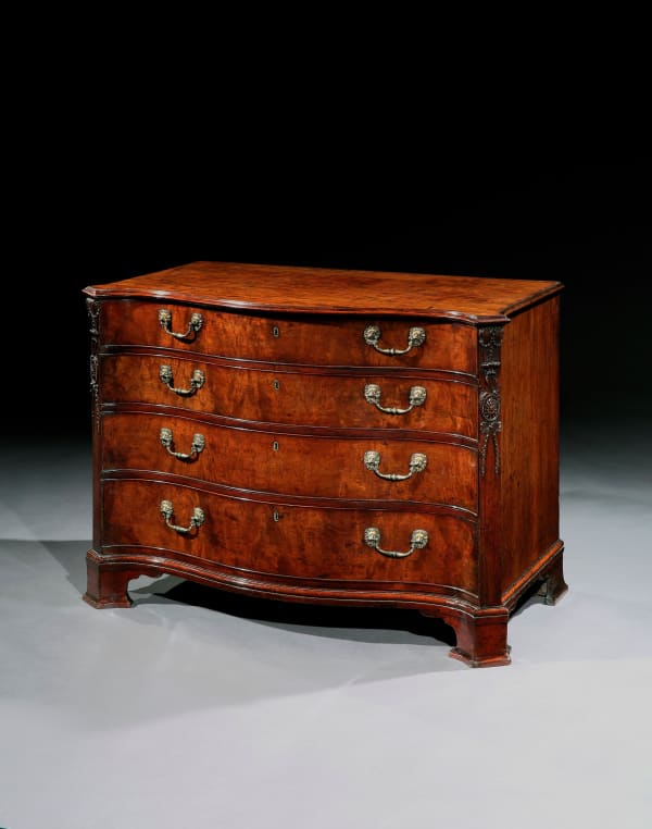 AN IMPORTANT EARLY GEORGE III MAHOGANY SERPENTINE COMMODE