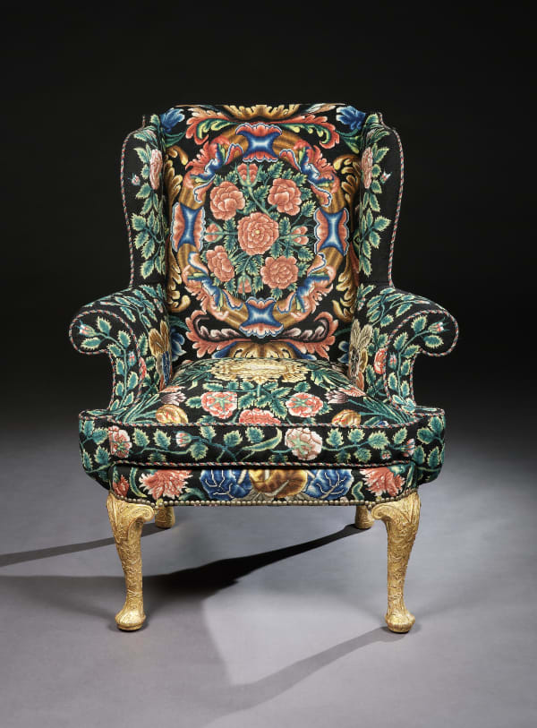 A GEORGE I GESSO AND NEEDLEWORK WING CHAIR