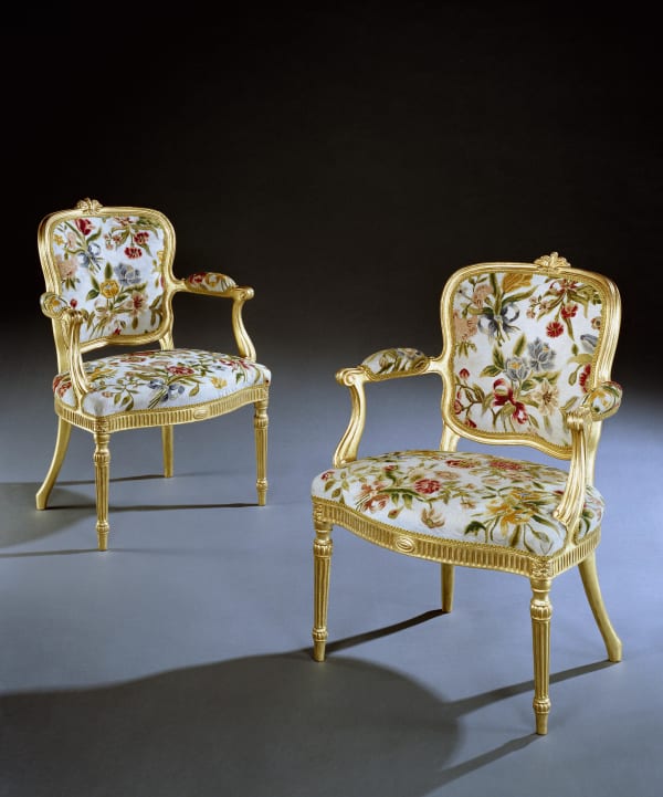 A PAIR OF GEORGE III ARMCHAIRS ATTRIBUTED TO THOMAS CHIPPENDALE
