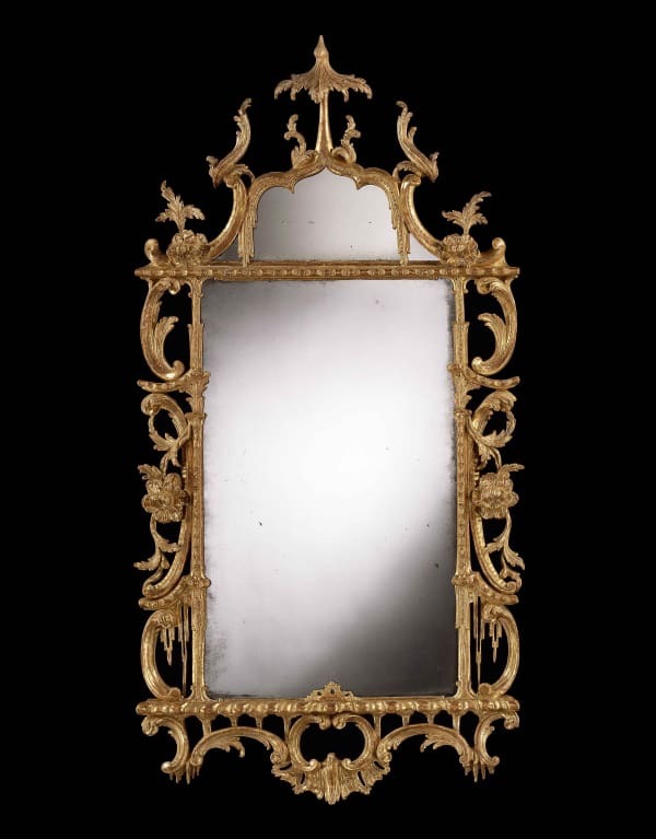 A GEORGE III CARVED GILTWOOD MIRROR