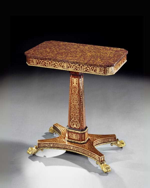 A REGENCY AMBOYNA BRASS INLAID CENTRE TABLE