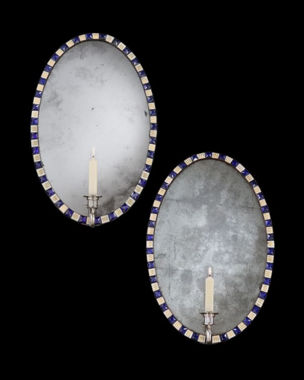 A PAIR OF IRISH GEORGE III OVAL MIRROR GIRANDOLES