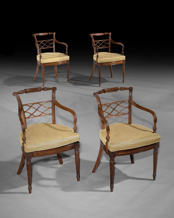 A SET OF EIGHT GEORGE III MAHOGANY ARMCHAIRS, English, circa 1790