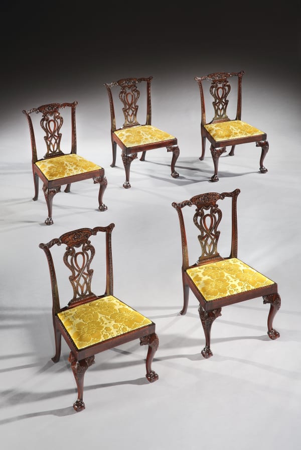 A set of ten George II mahogany dining chairs