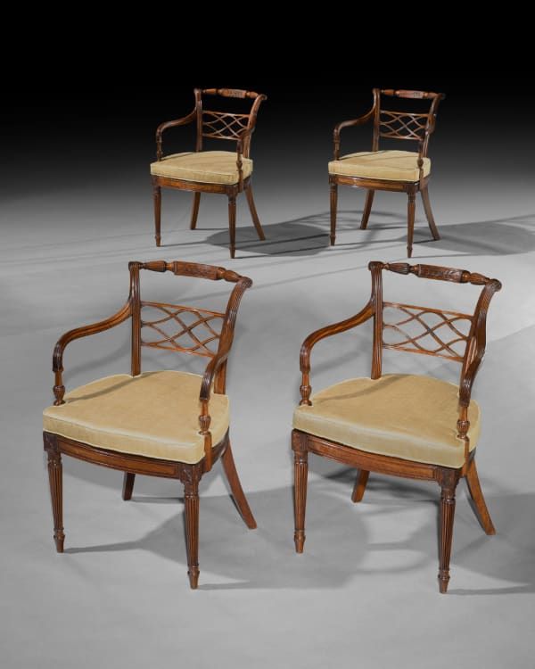 A SET OF EIGHT GEORGE III MAHOGANY ARMCHAIRS, English, circa 1790