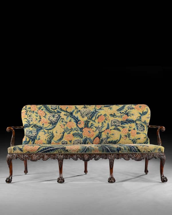 THE PERCIVAL GRIFFITHS RAMSBURY MANOR SETTEE, The settee: English, circa 1750 The associated needlework cover: English, circa 1750