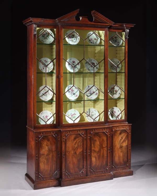 A GEORGE II MAHOGANY BREAKFRONT BOOKCASE