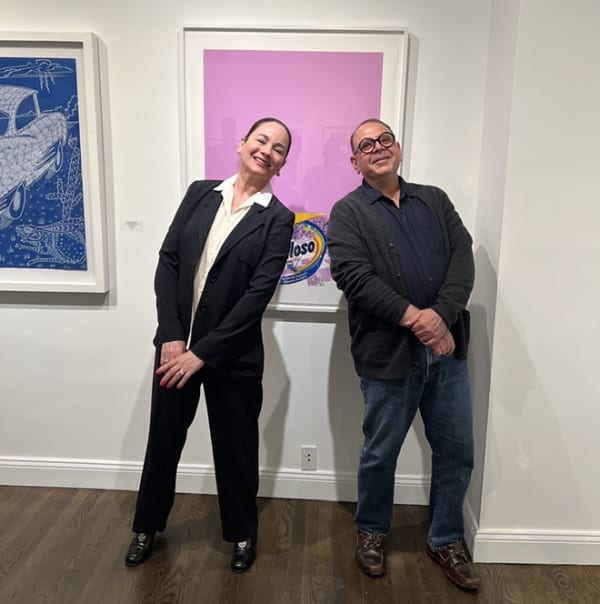 Patricia Ruiz-Healy poses with San Antonio-born artist Alejandro Diaz in her New York City gallery.