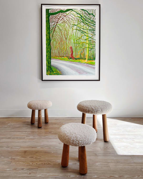 David Hockney. The Arrival of Spring in Woldgate, East Yorkshire in 2011, 18 January. 2011. iPad drawing printed on paper, 139.8 by 105.5 cm (55 by 41½ in.). 19/25 from an edition of 25 Anonymous. Three Lilla Svampen Stools. 2021, Swedish pine and Australian shearling S: 36 by 34 cm (14 ⅛ by 13 ⅜ in.) M: 40.8 by 40 cm (16⅛ by 15¾ in.) L: 47.3 by 44.5 cm (18⅝ by 17½ in.)