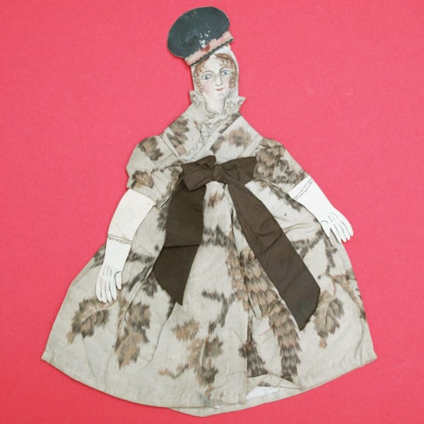Collection of 19th century home toy theatre paper cut outs. This one has a chine fabric dress.