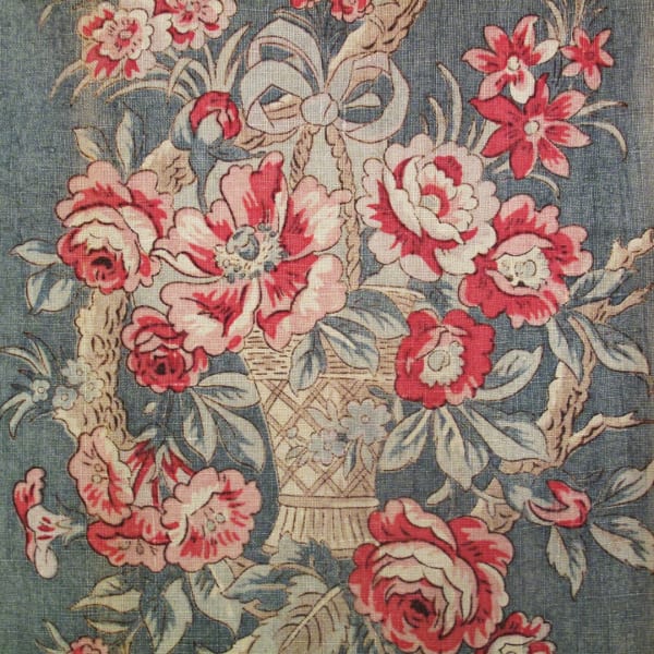 Vintage linen panel printed with rose design in muted shades.