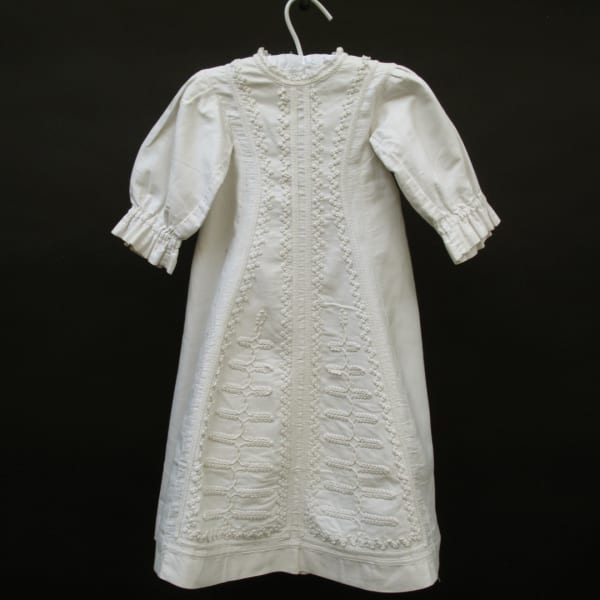 Charming baby's winter gown with delicate embroidery.