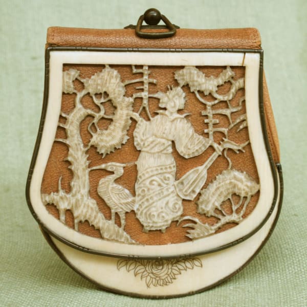 Beautiful leather and bone carved bag made in Asia, circa 1880.