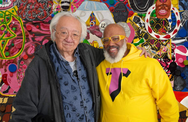 Trenton Doyle Hancock, “Coloration Coronation” (2016), acrylic and mixed media on canvas (Pizzuti Collection, Columbus, Ohio; image courtesy The Jewish Museum) overlaid with a photo of John Yau and the artist (photo Hrag Vartanian/Hyperallergic)
