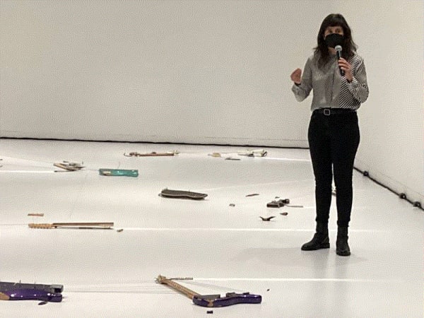Israeli artist Naama Tsabar amid her "Melodies of Certain Damage (Opus 6)" at the Wadsworth Atheneum. She and several local musicians will perform on the broken electric guitars that comprise the exhibit on its closing weekend Sept. 10 and 11. (Christopher Arnott)