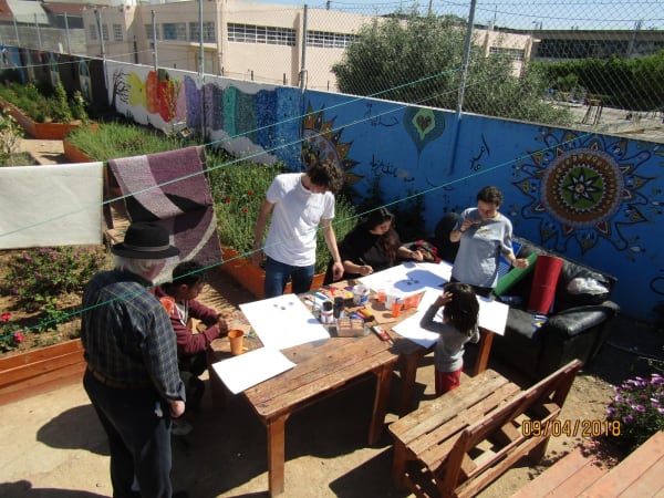 John Behan working with refugees at Eleonas camp in Athens during an earlier visit this year.