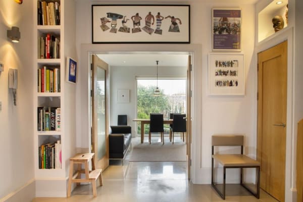 A detail of the hall looking into the dining area. The couple installed double doors, which add a spacious feel