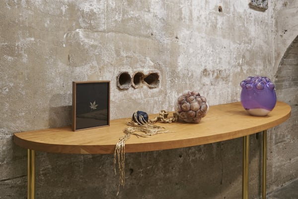 Akashi sculpture, glass objects on table