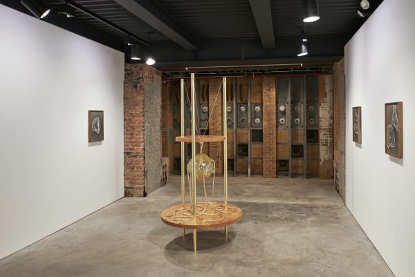 Akashi sculpture, glass objects on table