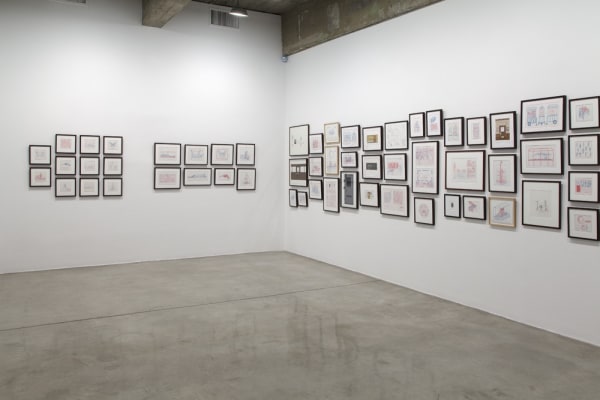 installation view of framed drawings