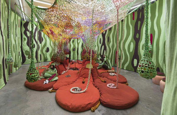 Ernesto Neto installation with instruments, hanging crochet