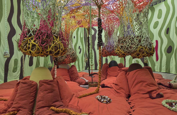 Ernesto Neto installation with instruments, hanging crochet