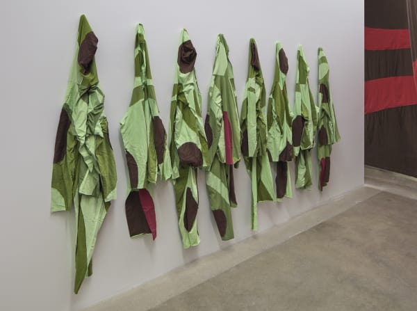 Ernesto Neto installation with instruments, hanging crochet, jumpsuits