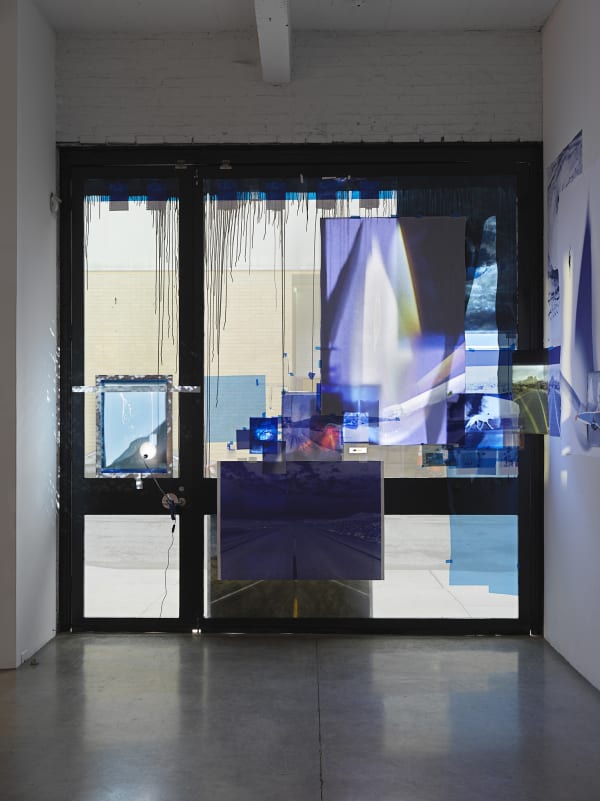 Sarah Sze, installation view of video projections in window