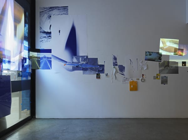 Sarah Sze, installation view of video projections and images on wall