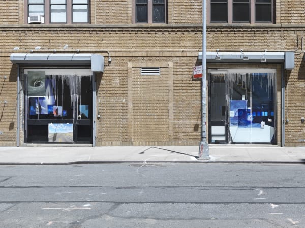 outside of gallery with collaged windows