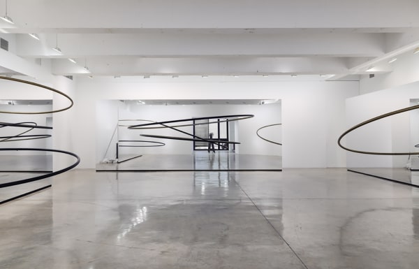Image of Eliasson, mirrored panels reflecting circular sculptures
