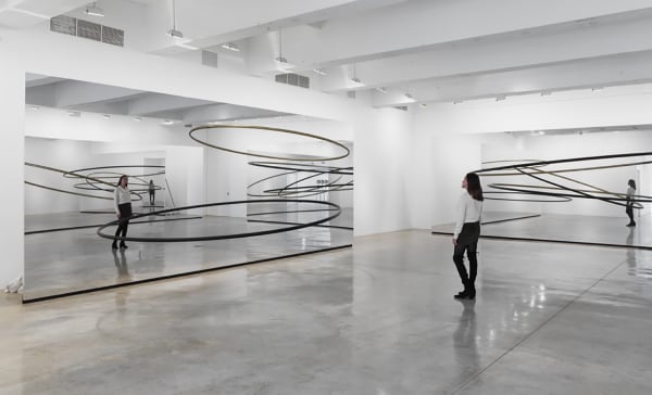 Image of Eliasson, mirrored panels reflecting circular sculptures