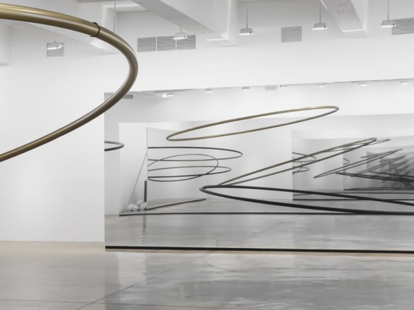 Image of Eliasson, mirrored panels reflecting circular sculptures