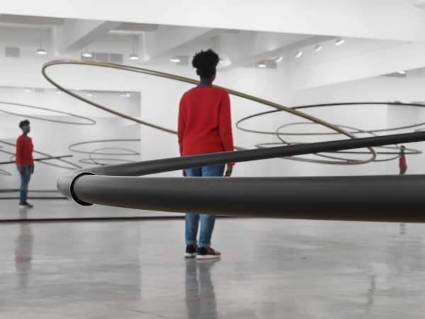 Image of Eliasson, mirrored panels reflecting circular sculptures