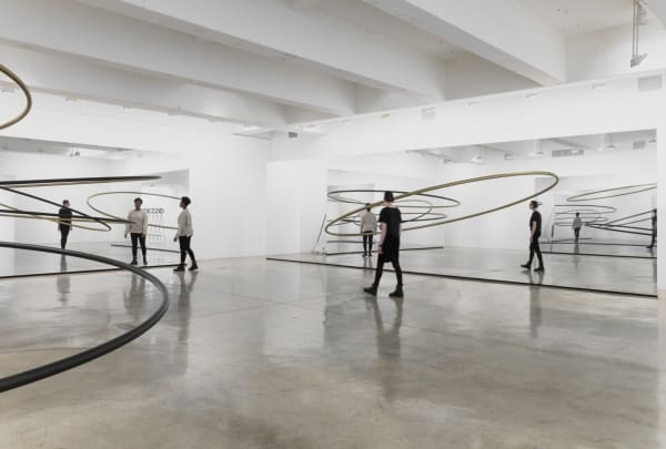 Image of Eliasson, mirrored panels reflecting circular sculptures