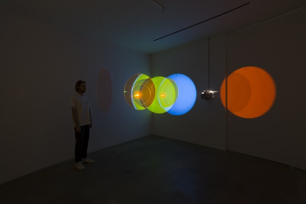 image of eliasson, lens flare installation in dark room