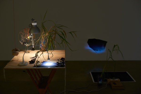 Sarah Sze installation in dark room