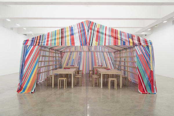 image of a Meschac Gaba tent with tables and drawing material inside