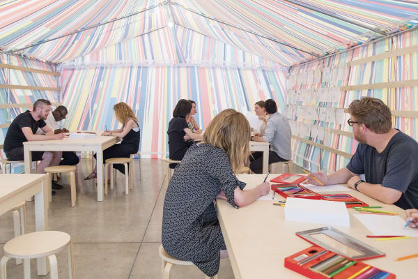 image of a Meschac Gaba tent with tables and drawing material inside