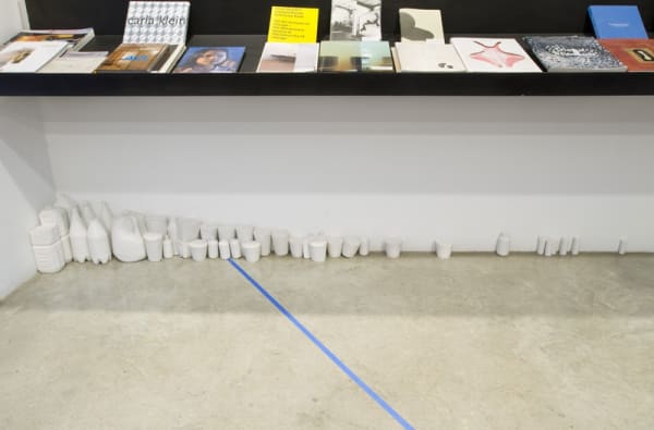 models under bookshelves