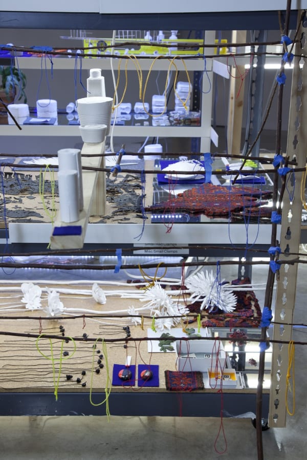 sarah sze installation view of large structure with dimmed lights