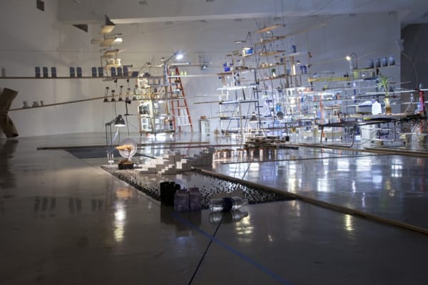sarah sze installation view of large structure with dimmed lights