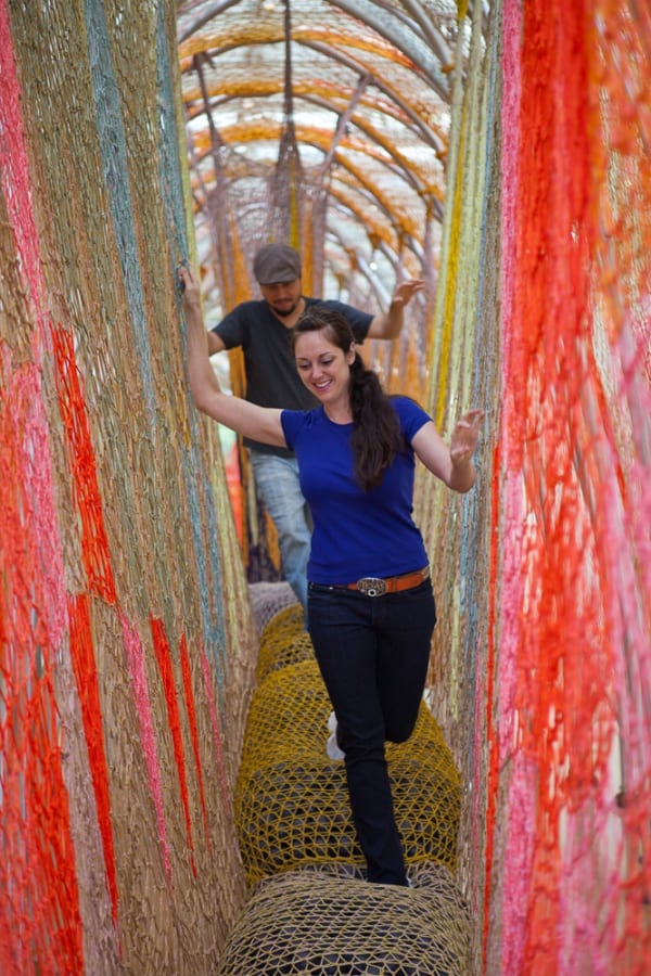 Ernesto Neto crochet structure, people walking inside