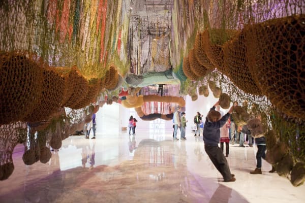 Ernesto Neto crochet hanging installation, walkway for visitors with people