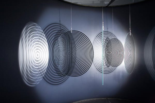 Eliasson dark room with shadows turning disc