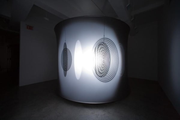 Eliasson dark room with shadows turning disc