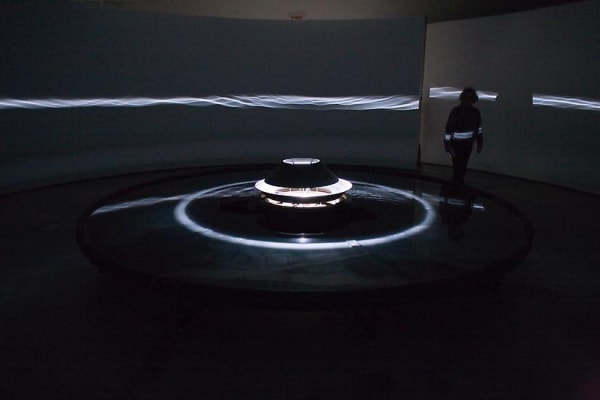 Eliasson dark room installation with light wave