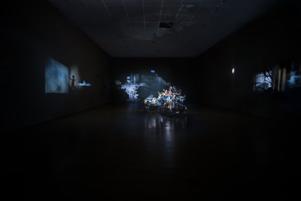Sarah Sze installation, projections on a desk